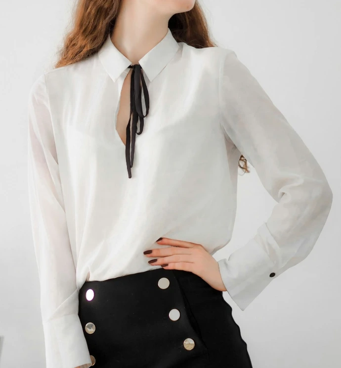 woman in white long sleeve shirt